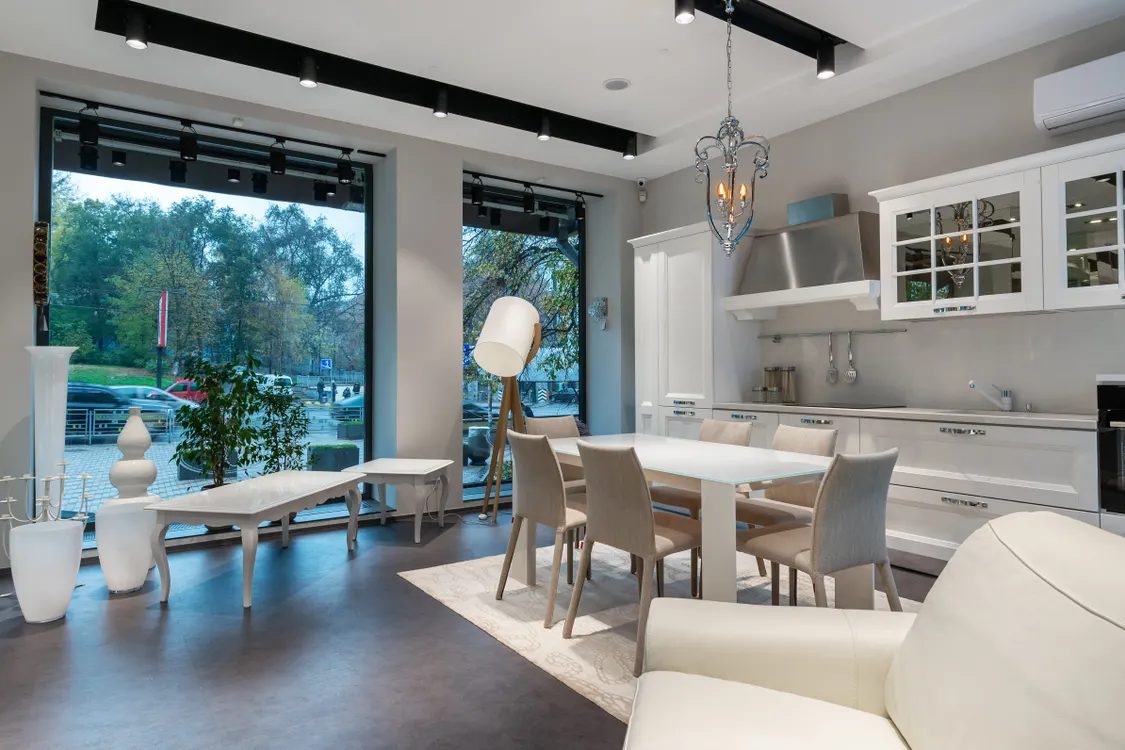 Open-plan apartment with kitchen and dining zone — illustrative concept