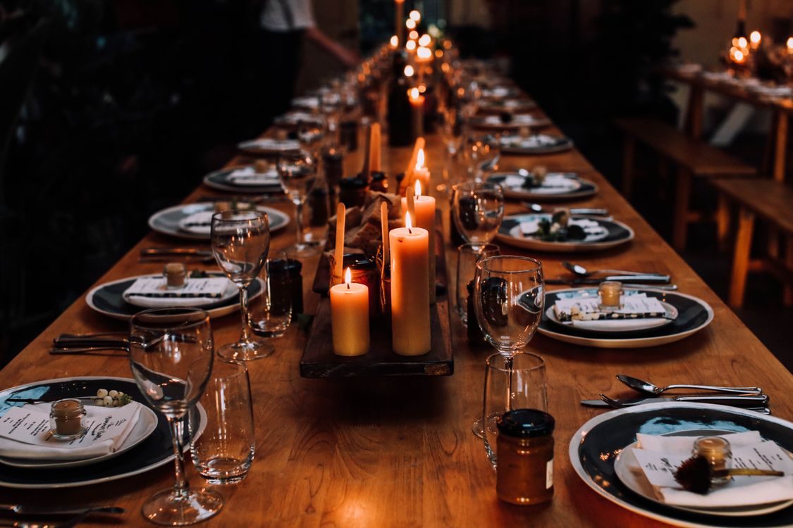Long banquet table set for dinner — illustrative concept
