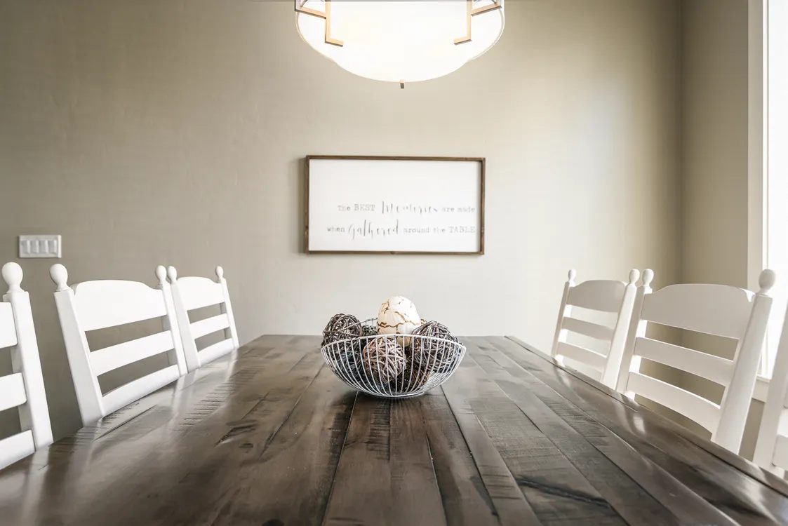 Wooden dining table with chairs — illustrative concept
