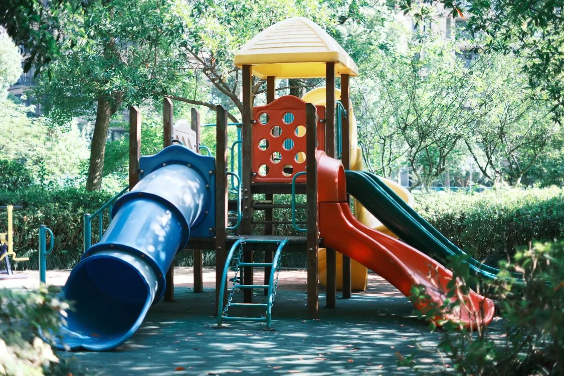 Playground slide in a sunny park — illustrative concept