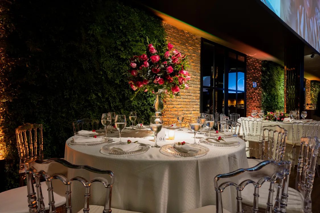 Round tables set for a reception — illustrative concept